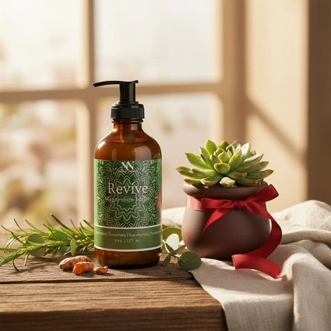 Revive Magnesium Lotion pump bottle with a potted succulent wrapped in a red ribbon