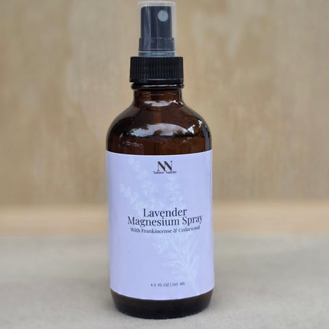 Amber glass Lavender Magnesium Spray bottle on a wooden surface