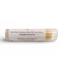 Tropics Pineapple Olive Oil Lip Balm tube showing ingredients label listing beeswax, olive oil, cocoa butter, and pineapple flavor oil