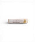 Olive Oil Lip Balm tube showing ingredients label listing beeswax, olive oil, cocoa butter, and pineapple flavor oil