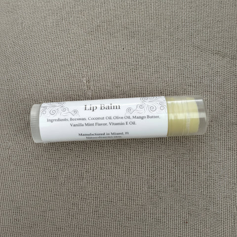 Vanilla Mint Olive Oil Lip Balm tube showing ingredients label listing beeswax, coconut oil, olive oil, mango butter, vanilla mint flavor, and vitamin E oil