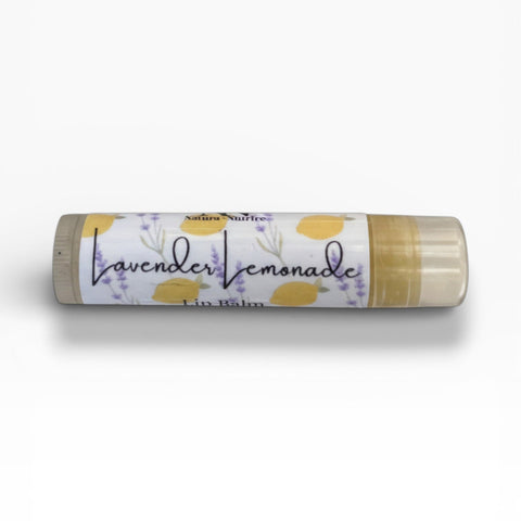Lavender Lemonade Olive Oil Lip Balm tube lying on its side on a white background