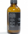 Obsidian Room Spray amber glass bottle showing ingredients label on the back