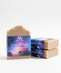 Luna Woods Handcrafted Soap bars with celestial purple and blue starry night packaging, stacked on a white background