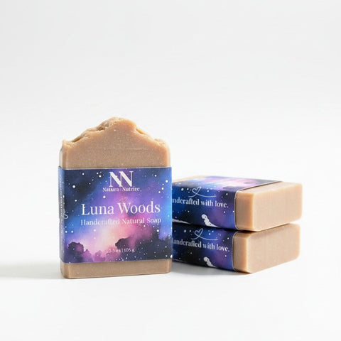 Luna Woods Handcrafted Soap bars with celestial purple and blue starry night packaging, stacked on a white background