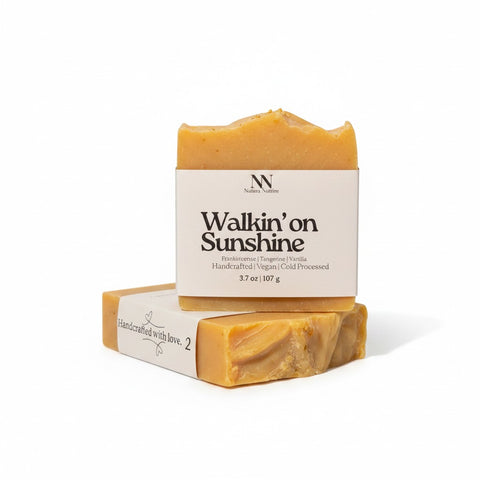 Walking on Sunshine Handcrafted Soap bars with kraft paper labels, boxed and unboxed, on a white background