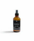 Obsidian Room Spray amber glass bottle with black label on a white background