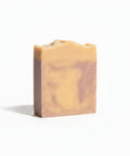 Lavender Dreamin' Handcrafted Soap bar with swirled beige and mauve marbling on a white background