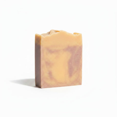 Lavender Dreamin' Handcrafted Soap bar with swirled beige and mauve marbling on a white background