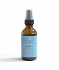 Serenity Essential Oil Room Spray amber glass bottle with blue label on a white background
