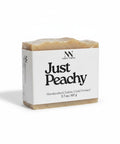 Just Peachy Tallow Soap bar wrapped in kraft paper label on a white background