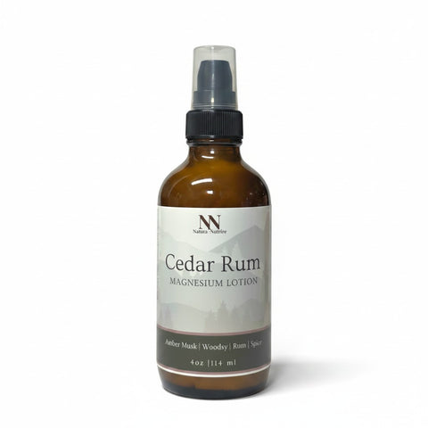 Cedar Rum Magnesium Lotion 4oz spray bottle with green and gray mountain-patterned label on a white background