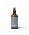 Serenity Magnesium Lotion 4oz spray bottle with teal mandala-patterned label on a white background