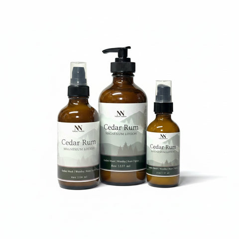 Three Cedar Rum Magnesium Lotion bottles - 8oz pump, 4oz spray, and 2oz spray - on a white background