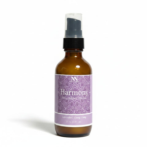 Harmony Magnesium Lotion 2oz spray bottle with purple mandala-patterned label on a white background