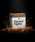 Havana Nights Tallow Soap bar with smoke and cinnamon sticks on a dark moody background
