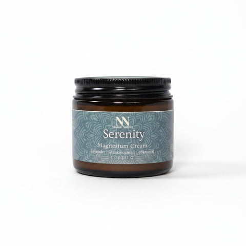 Serenity Magnesium Cream 2oz jar with teal mandala-patterned label on a white background
