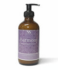 Harmony Magnesium Lotion 8oz pump bottle with purple mandala-patterned label on a white background
