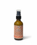 Bliss Magnesium Lotion 2oz pump bottle with orange mandala-patterned label on a white background