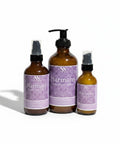 Three Harmony Magnesium Lotion bottles - 4oz spray, 8oz pump, and 2oz spray - with purple mandala-patterned labels on a white background