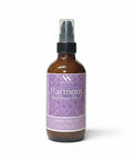 Harmony Magnesium Lotion 4oz spray bottle with purple mandala-patterned label on a white background