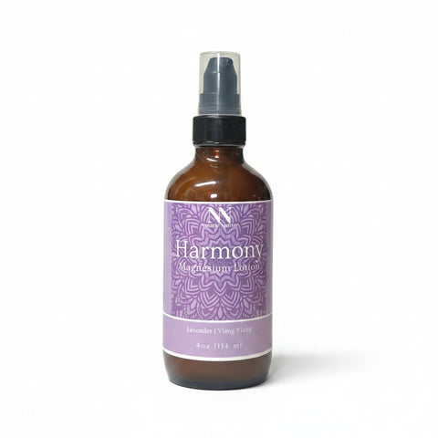 Harmony Magnesium Lotion 4oz spray bottle with purple mandala-patterned label on a white background