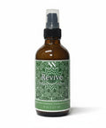 Revive Magnesium Lotion 4oz spray bottle with green mandala-patterned label on a white background