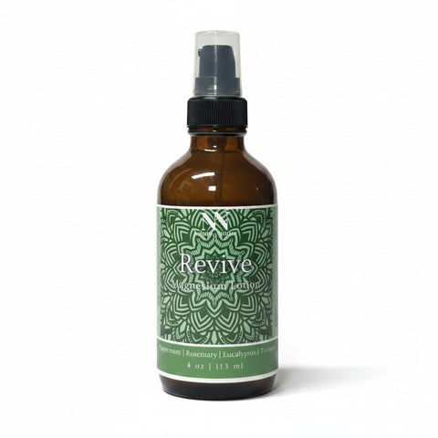 Revive Magnesium Lotion 4oz spray bottle with green mandala-patterned label on a white background