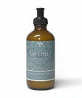 Serenity Magnesium Lotion 8oz pump bottle with teal mandala-patterned label on a white background