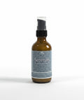 Serenity Magnesium Lotion 2oz spray bottle with teal mandala-patterned label on a white background