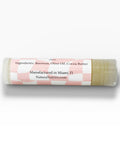 Unsalted Sally Fragrance-Free Olive Oil Lip Balm tube showing ingredients label listing beeswax, olive oil, and cocoa butter