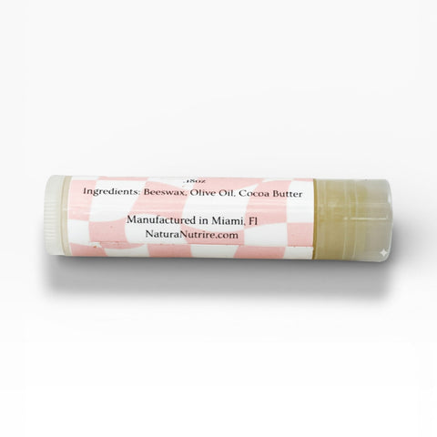 Unsalted Sally Fragrance-Free Olive Oil Lip Balm tube showing ingredients label listing beeswax, olive oil, and cocoa butter