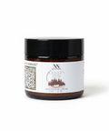 Natura+Nutrire Magnesium Cedar Rum muscle relief cream in a 2oz amber glass jar with a black lid.