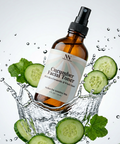 Cucumber Facial Toner with Rice Ceramides bottle splashing in water with sliced cucumbers and mint leaves on a light gray background
