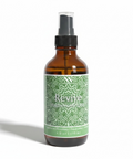 Revive Magnesium Spray amber glass bottle with green label on a white background