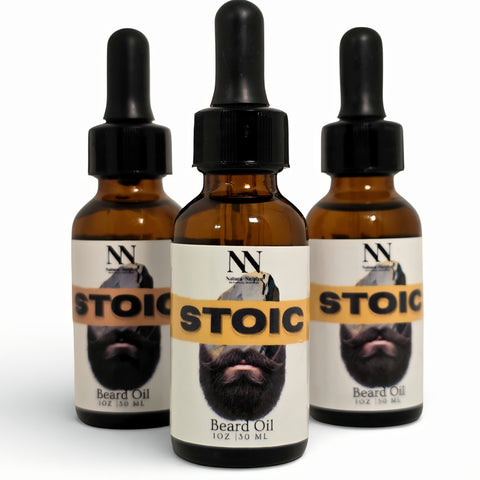 Three bottles of Stoic Beard Oil with droppers on a white background