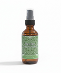 Revive Magnesium Spray 2.5oz travel-size bottle with green label on a white background