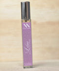 Lilac Handcrafted Non-Toxic Fragrance spray bottle standing on a light wood surface