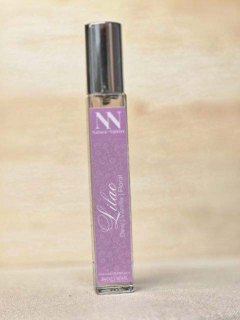 Lilac Handcrafted Non-Toxic Fragrance spray bottle standing on a light wood surface