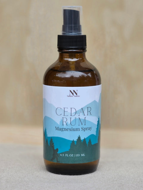 Cedar Rum Magnesium Spray bottle with mountain-themed label on a neutral linen background